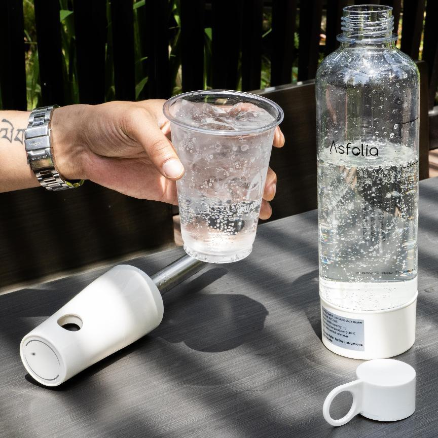 Asfolia sparkling water being poured into a glass